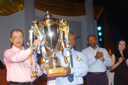 President Michel hands the Sportsman of the Year cup to Malcouzane