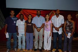 Minister Meriton in a group photograph with the badminton medallists