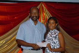 Female sailor Meggy Gertrude receives her R10,000 cheque from Minister Meriton
